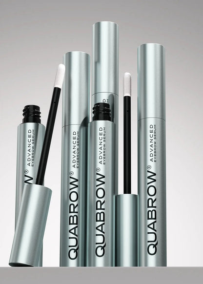 QUABROW Eyebrow Serum Trio Set arranged upright with open applicators on a soft grey background